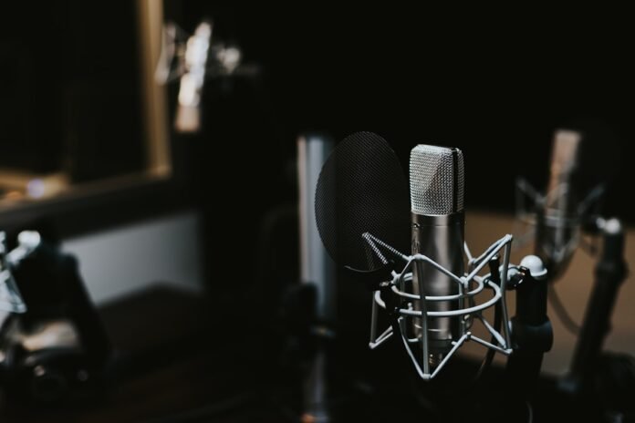 Open-source TTS 2026 — studio microphone representing text-to-speech voice generation